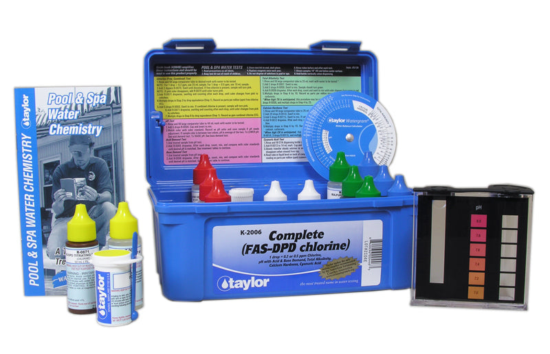 Taylor K-2006 FAS-DPD pool test kit open showing blue carrying case, reagent bottles, and color comparator.