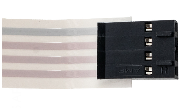 Close-up of the 14-pin keyed connector on the Hayward HDXFUIBRD001 ribbon cable, ensuring a secure and correct orientation to the HDF400 heater control board.