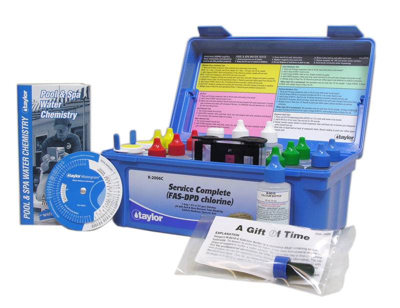 Taylor K-2006C commercial pool test kit open showing large 2oz reagent bottles and heavy-duty blue carrying case.